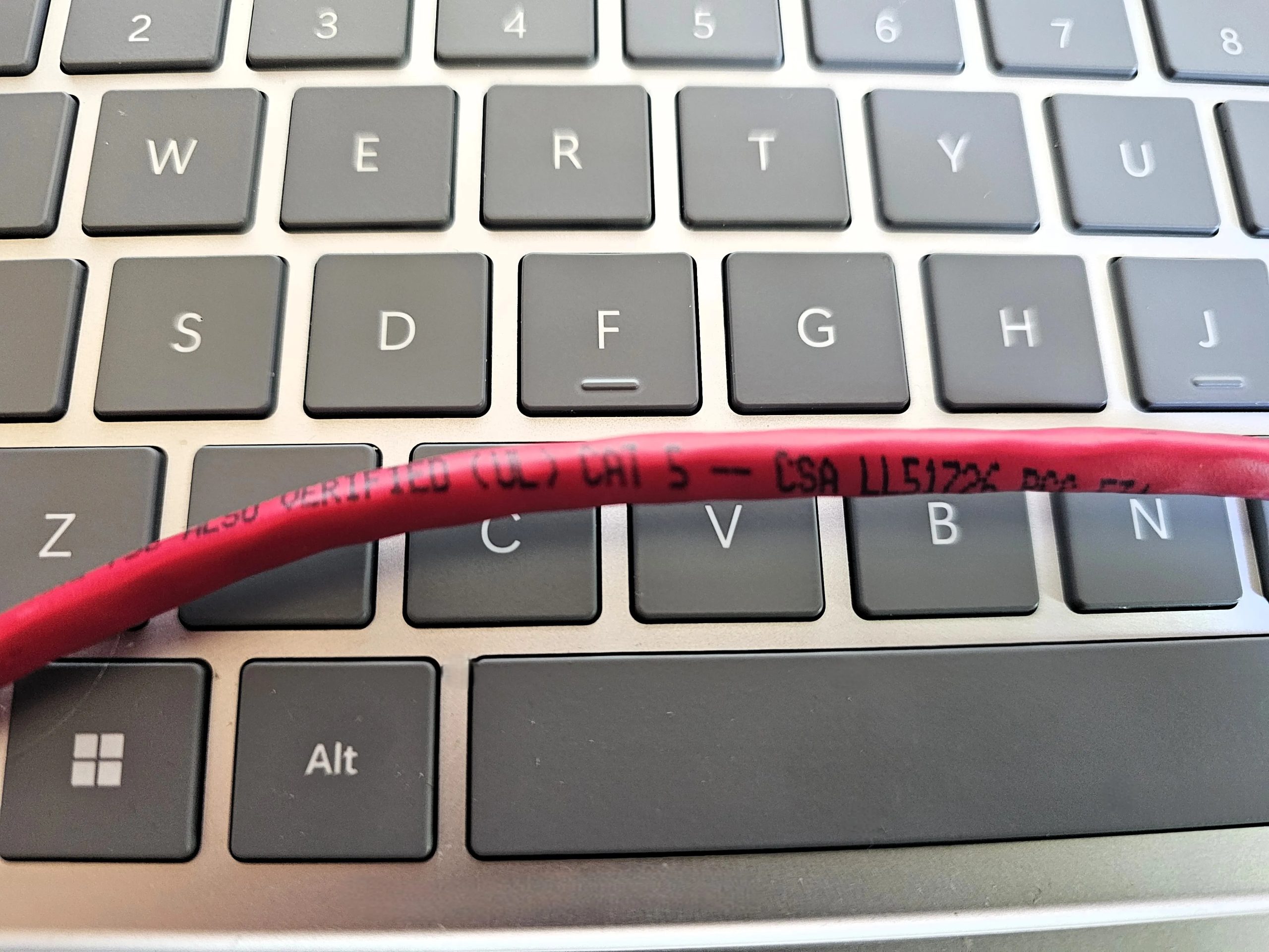 Cat 5 cable on keyboard